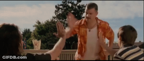 Man In Orange Shirt High Fiving Two People GIF