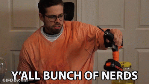 Man In Orange Shirt Holding Hose Says Y'all Bunch Of Nerds GIF