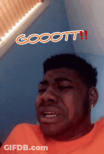 Man In Orange Shirt Making Funny Face Gocott GIF