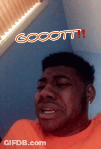 Man In Orange Shirt Making Funny Face With Gooott GIF