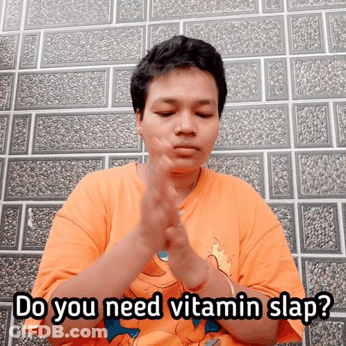 Man In Orange Shirt Saying Do You Need Vitamin Slap GIF