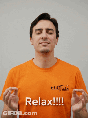 Man In Orange Shirt Saying Relax With Eyes Closed GIF