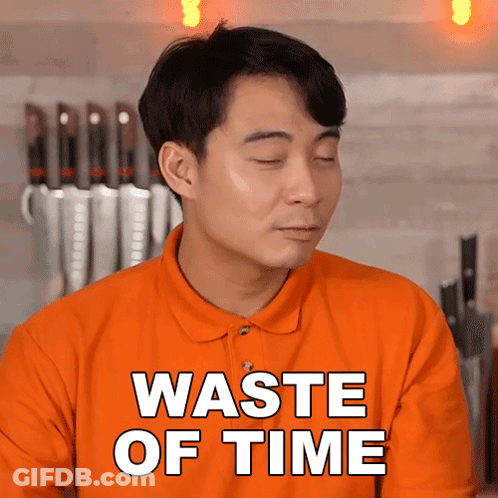 Man In Orange Shirt Saying Waste Of Time GIF