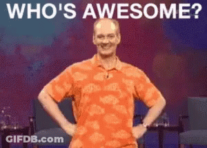 Man In Orange Shirt Saying Who's Awesome GIF