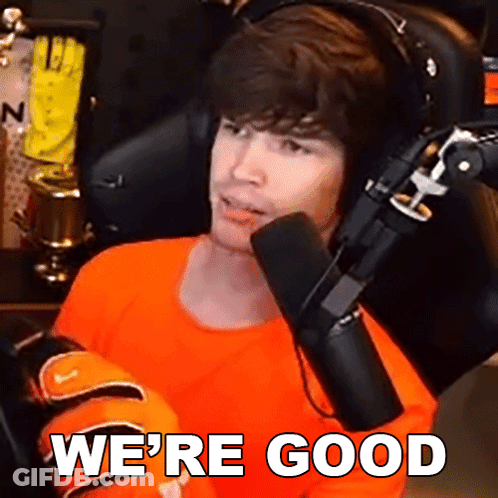 Man In Orange Shirt Sitting In Front Of Microphone Saying We're Good GIF