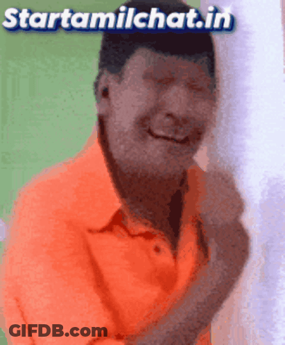 Man In Orange Shirt Smiling GIF