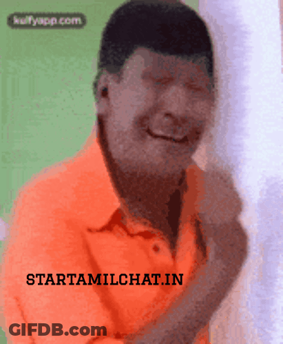 Man In Orange Shirt Smiling GIF