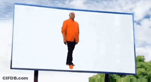 Man In Orange Shirt Standing By White Billboard GIF
