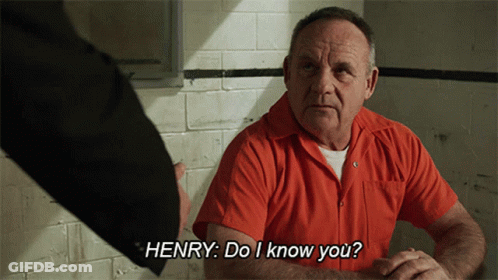 Man In Orange Shirt Talking To Henry GIF