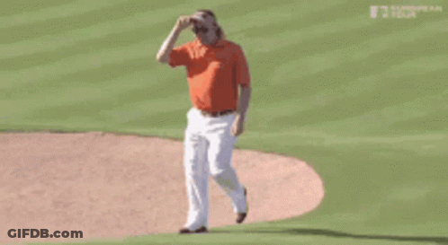 Man In Orange Shirt Throwing Baseball GIF