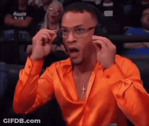 Man In Orange Shirt Wearing Headphones And Cross Necklace GIF