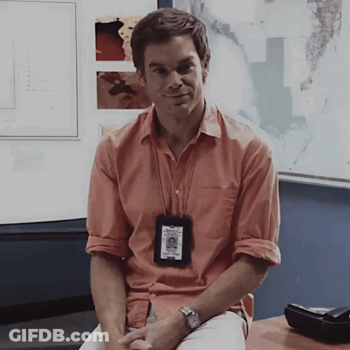 Man In Orange Shirt With Dexter Badge GIF
