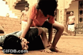 Man In Orange Shirt Wrestling GIF
