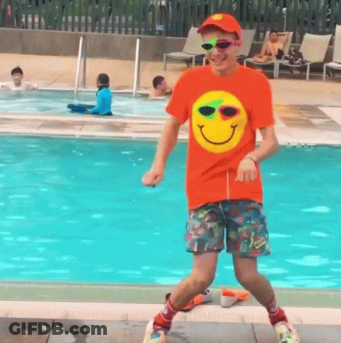 Man In Orange Smiley Shirt Dancing GIF