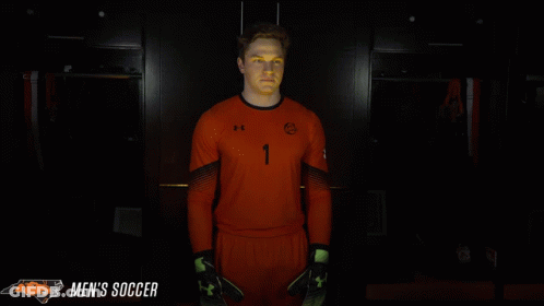 Man In Orange Soccer Uniform Number 1 GIF