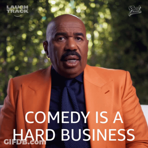 Man In Orange Suit Comedy Is A Hard Business GIF