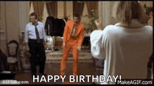 Man In Orange Suit Dancing GIF