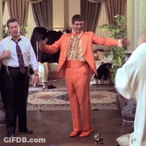 Man In Orange Suit Dancing GIF