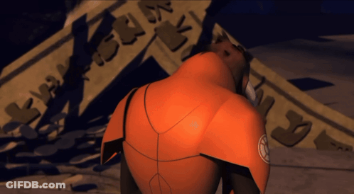 Man In Orange Suit Standing In Front Of N's Sign GIF