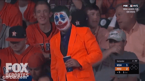 Man In Orange Suit Watching Baseball GIF