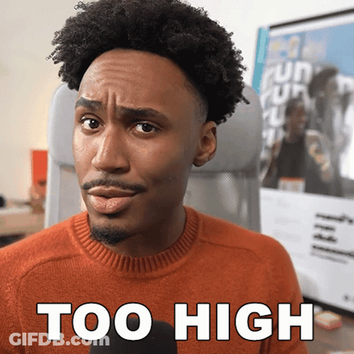Man In Orange Sweater Making Funny Face Saying Too High GIF