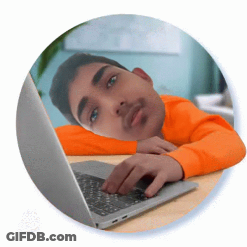 Man In Orange Sweater Using Laptop GIF