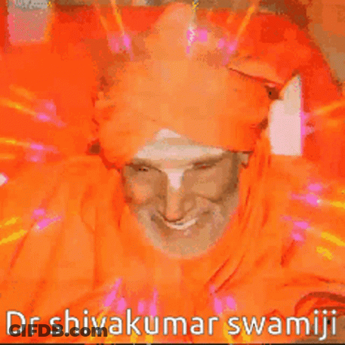 Man In Orange Turban Smiling Dr Shivakumar Swamji GIF