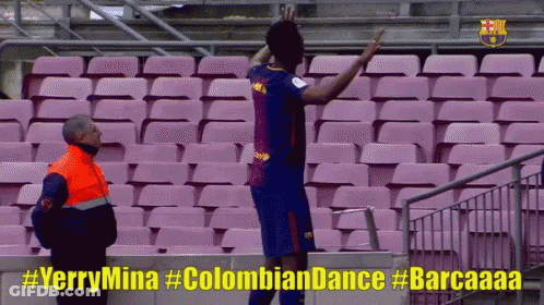 Man In Orange Vest Next To Soccer Player #Yerrymina #Colombian Dance #Barcaaaa GIF
