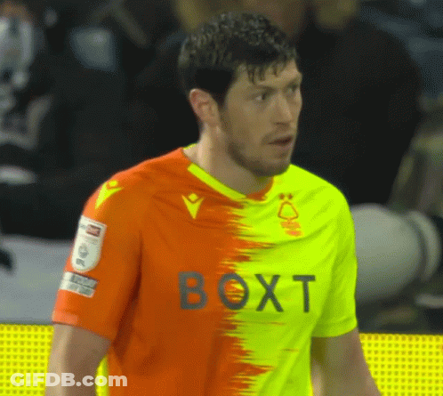 Man In Orange Yellow Shirt With Boxt GIF
