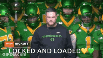 Man In Oregon Sweatshirt With Football Players GIF
