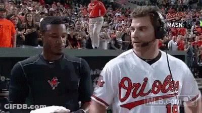 Man In Orioles Jersey Talking In Dugout GIF