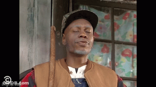 Man In Overalls And Hat Holding Cane By Window GIF