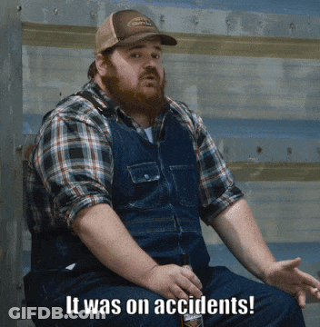 Man In Overalls And Plaid Shirt Saying It Was An Accident GIF