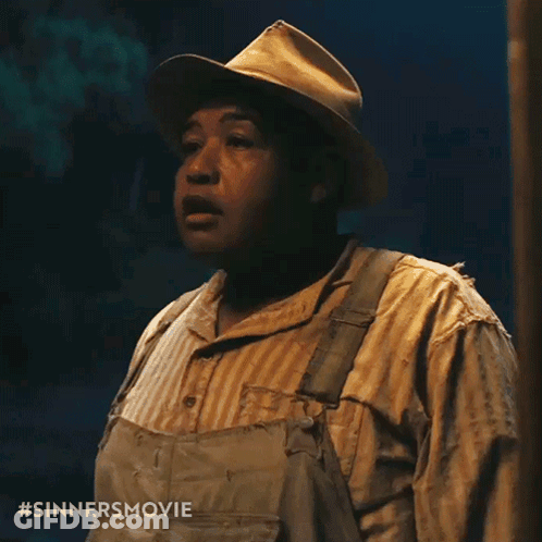 Man In Overalls And Striped Shirt With Sinners Movie GIF