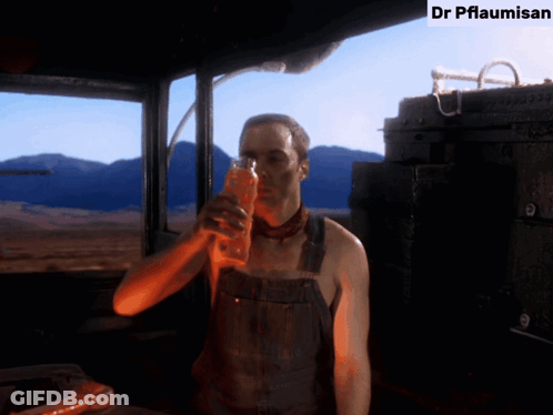 Man In Overalls Drinking Dr Pflaumisan GIF