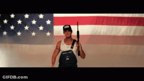 Man In Overalls Holding Gun GIF