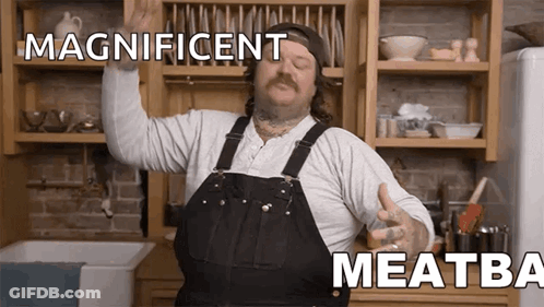 Man In Overalls In Kitchen With Arms In Air And Magnificent Meatba GIF
