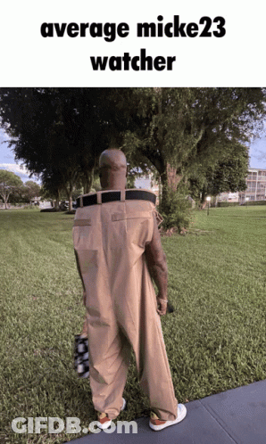 Man In Overalls Walking With Average Mick23 Watcher GIF