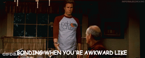 Man In Pablo Cruise Shirt Standing Next To Older Man GIF