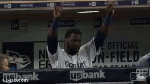 Man In Padres Jersey Hands In Air In Dugout GIF