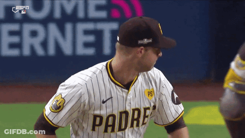 Man In Padres Jersey Stands On Field GIF