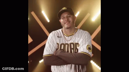 Man In Padres Jersey With Arms Crossed Smiling GIF