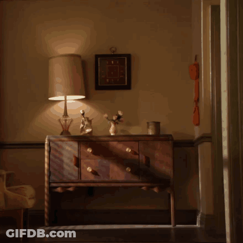 Man In Pajamas Standing In Front Of Dresser GIF