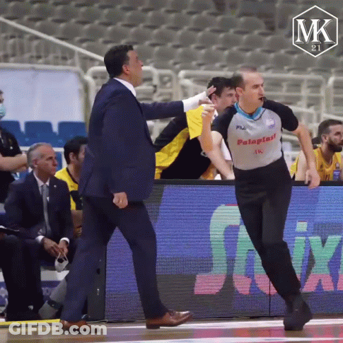 Man In Palaplast Shirt Talking To Another Man GIF