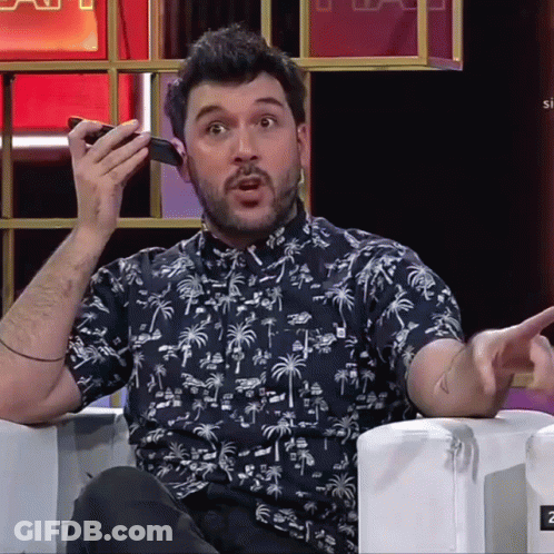 Man In Palm Tree Shirt Talking On Phone GIF