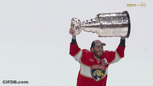 Man In Panthers Jersey Holding Trophy GIF