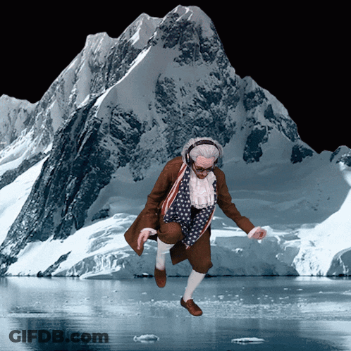 Man In Patriotic Outfit Jumping By Snowy Mountain GIF