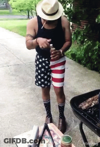 Man In Patriotic Shorts And Socks Smoking Cigarette GIF