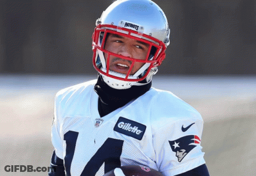 Man In Patriots Jersey And Gillette Helmet Holding Football GIF