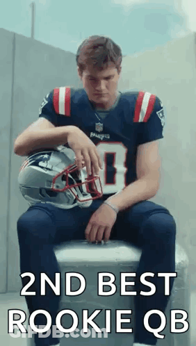 Man In Patriots Jersey Sitting On Cooler Holding Helmet GIF